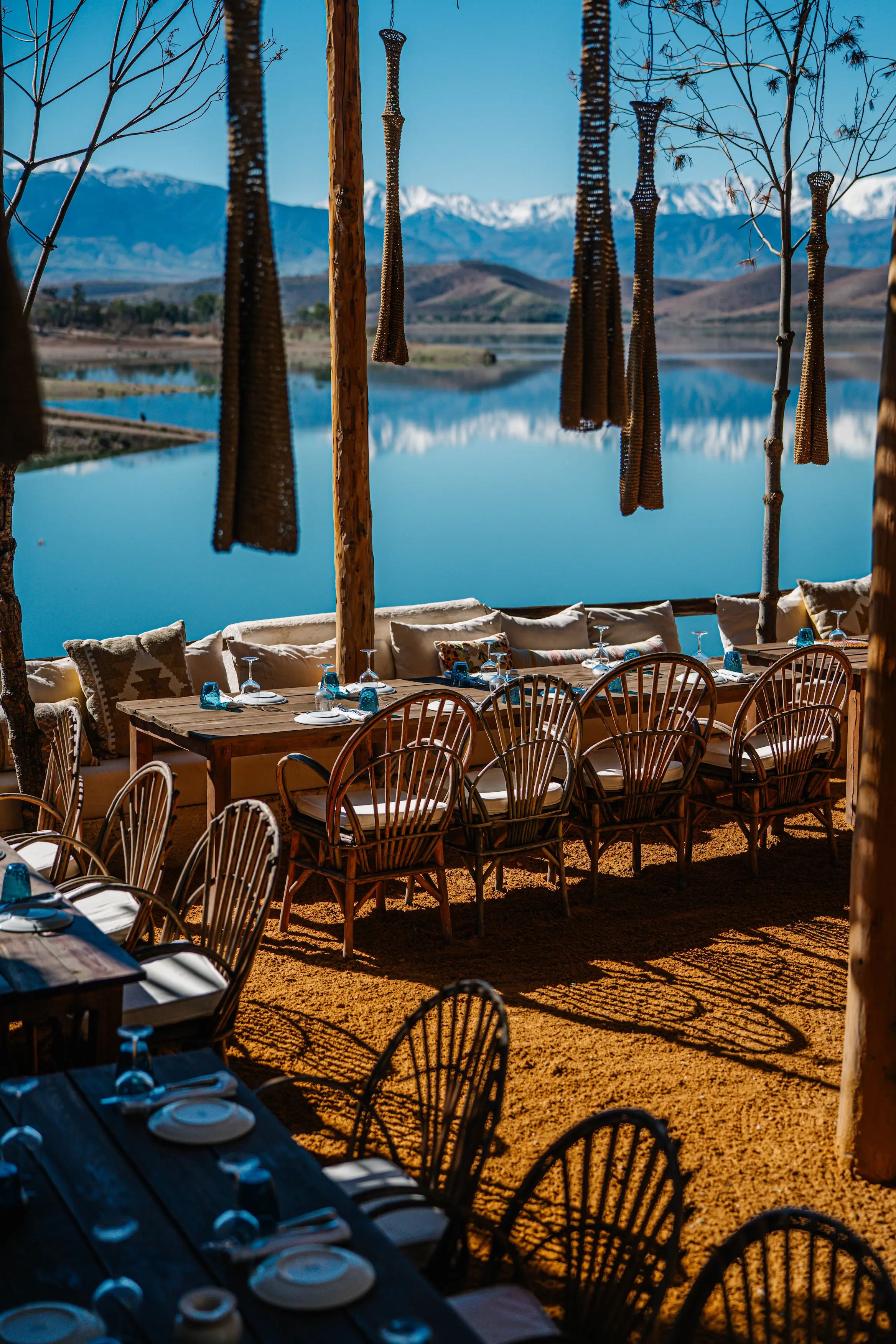 Luxury Lakeside Dining Terrace with Exclusive Ibiza Vibes Luxury lakeside dining terrace with exclusive Ibiza vibes and stunning views of Lake Takerkoust, the perfect Marrakech day club destination
