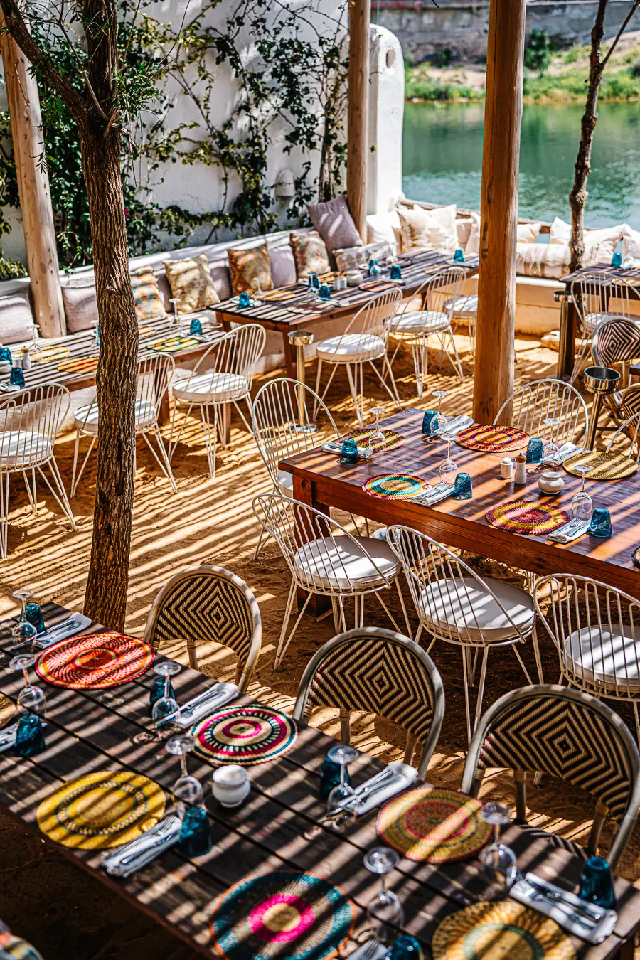 Mykonos-inspired boho-chic lounge setup offering a relaxing VIP desert oasis experience