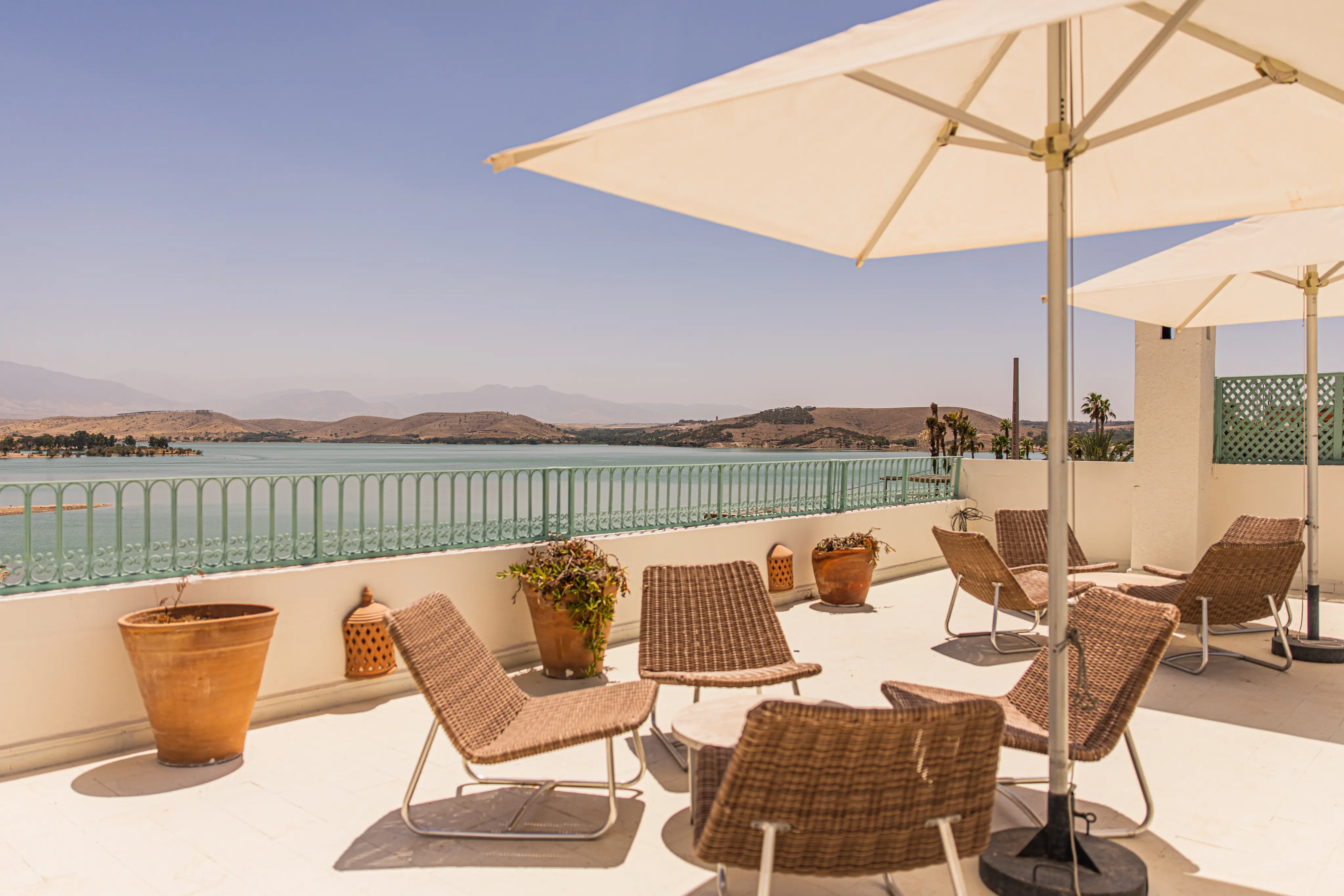 Snow-capped Atlas Mountains serving as a breathtaking backdrop for guests relaxing at Casa Lalla Hotel Rural.