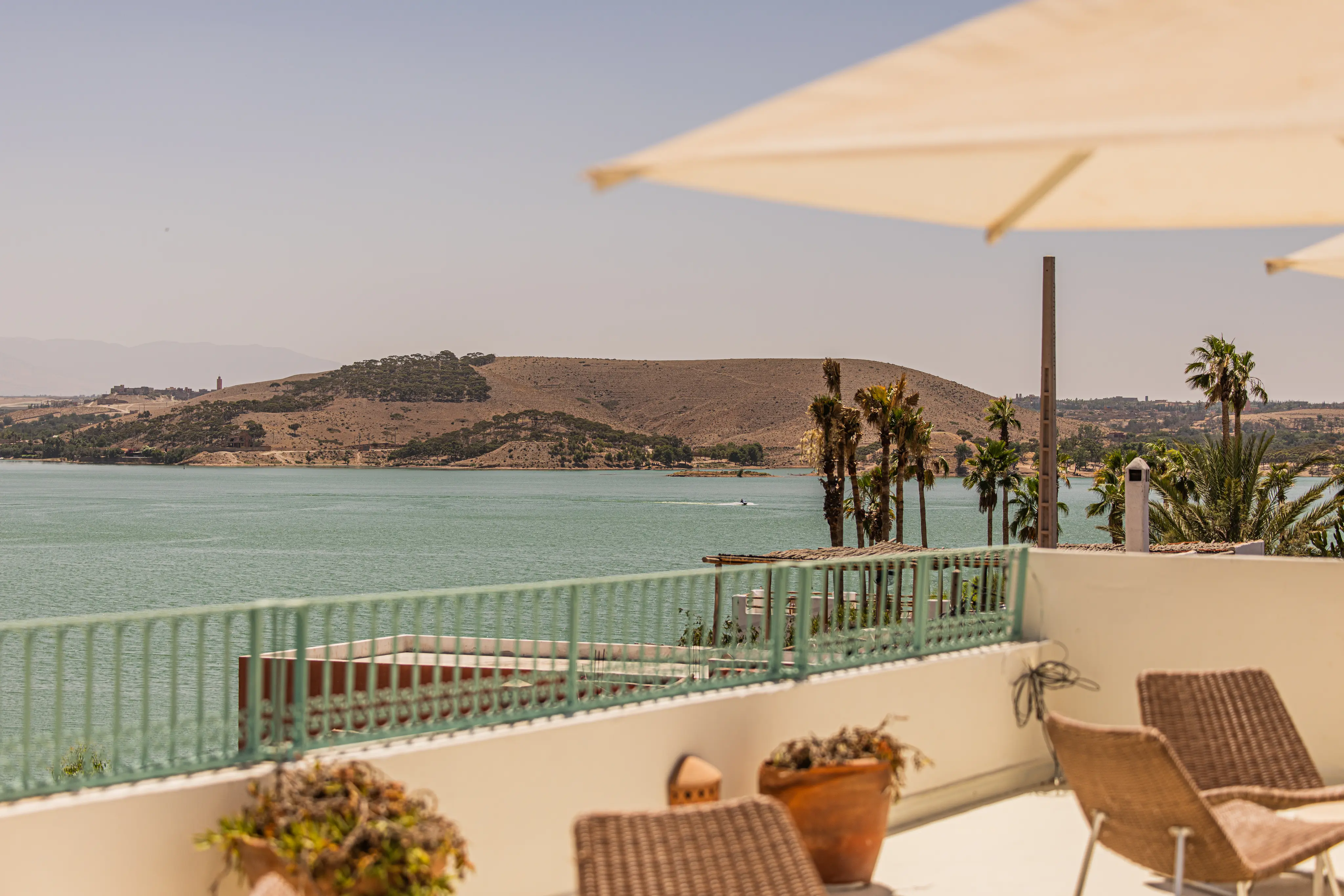 Exterior of Casa Lalla Hotel Rural overlooking the shimmering waters of Lake Lalla Takerkoust.