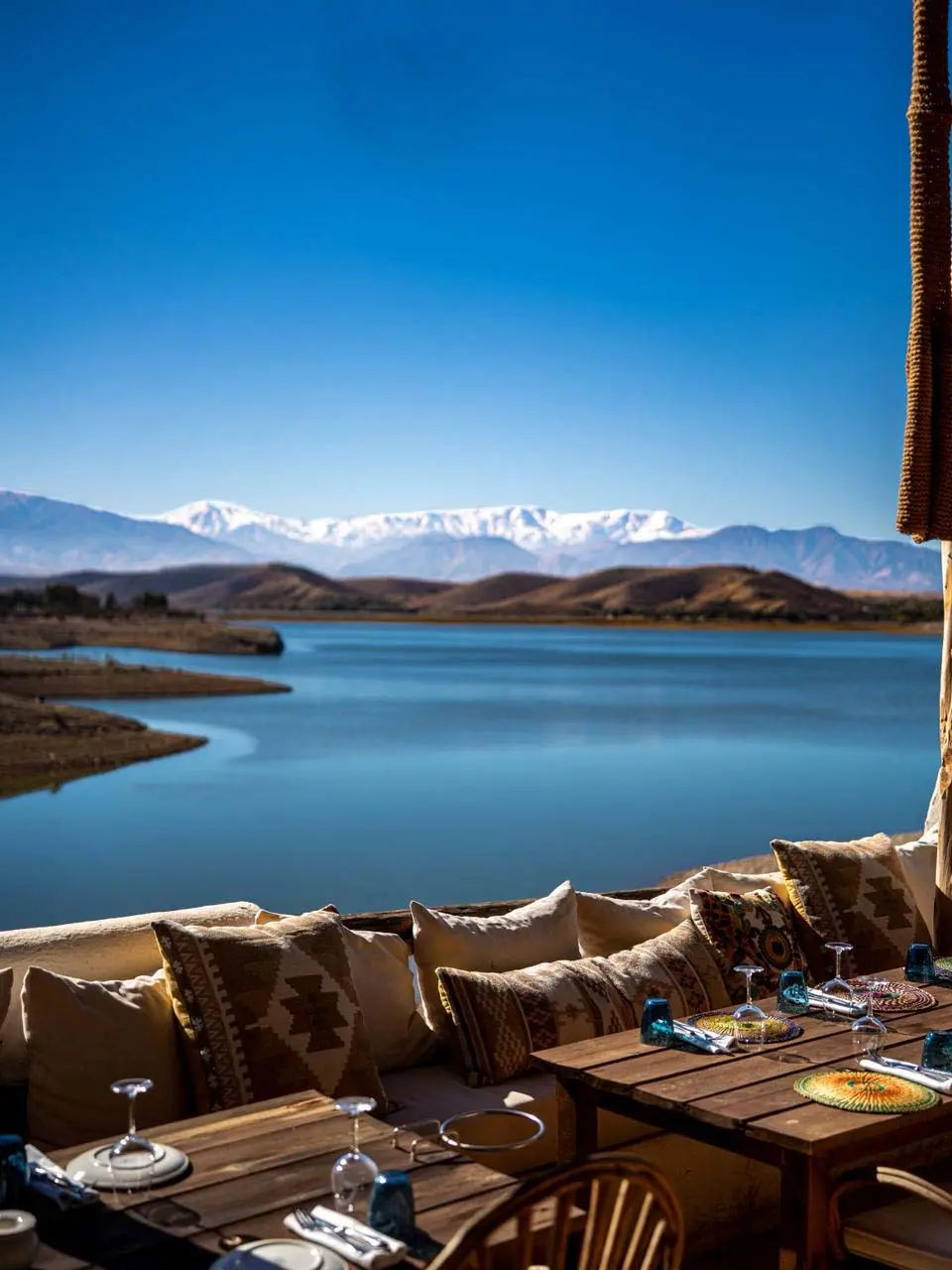 Mykonos chic lakeside dining and boho-chic atmosphere at Lake Lalla Takerkoust in Morocco