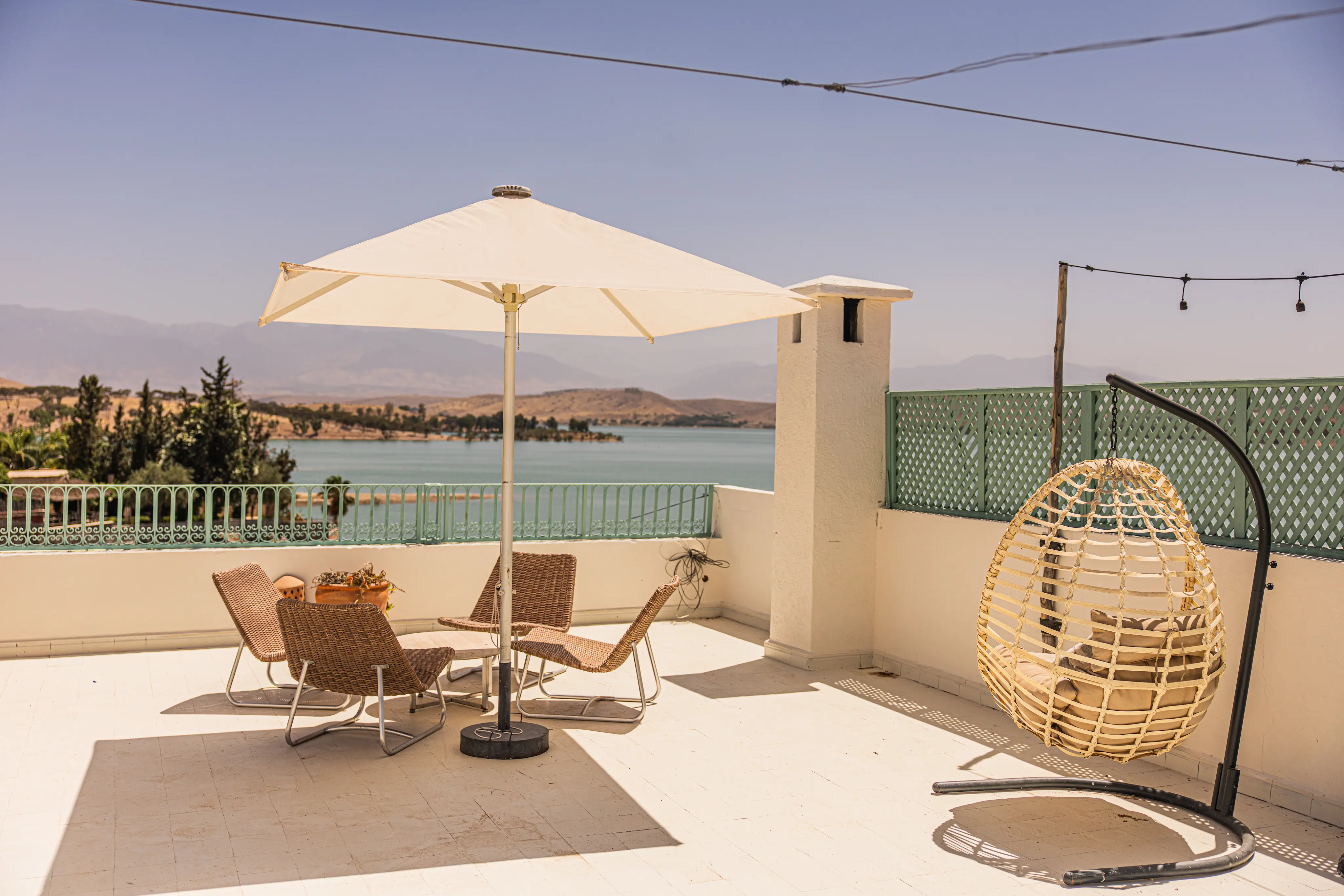 Serene swimming pool oasis surrounded by nature and plush sunbeds at Casa Lalla Hotel Rural near Marrakech.