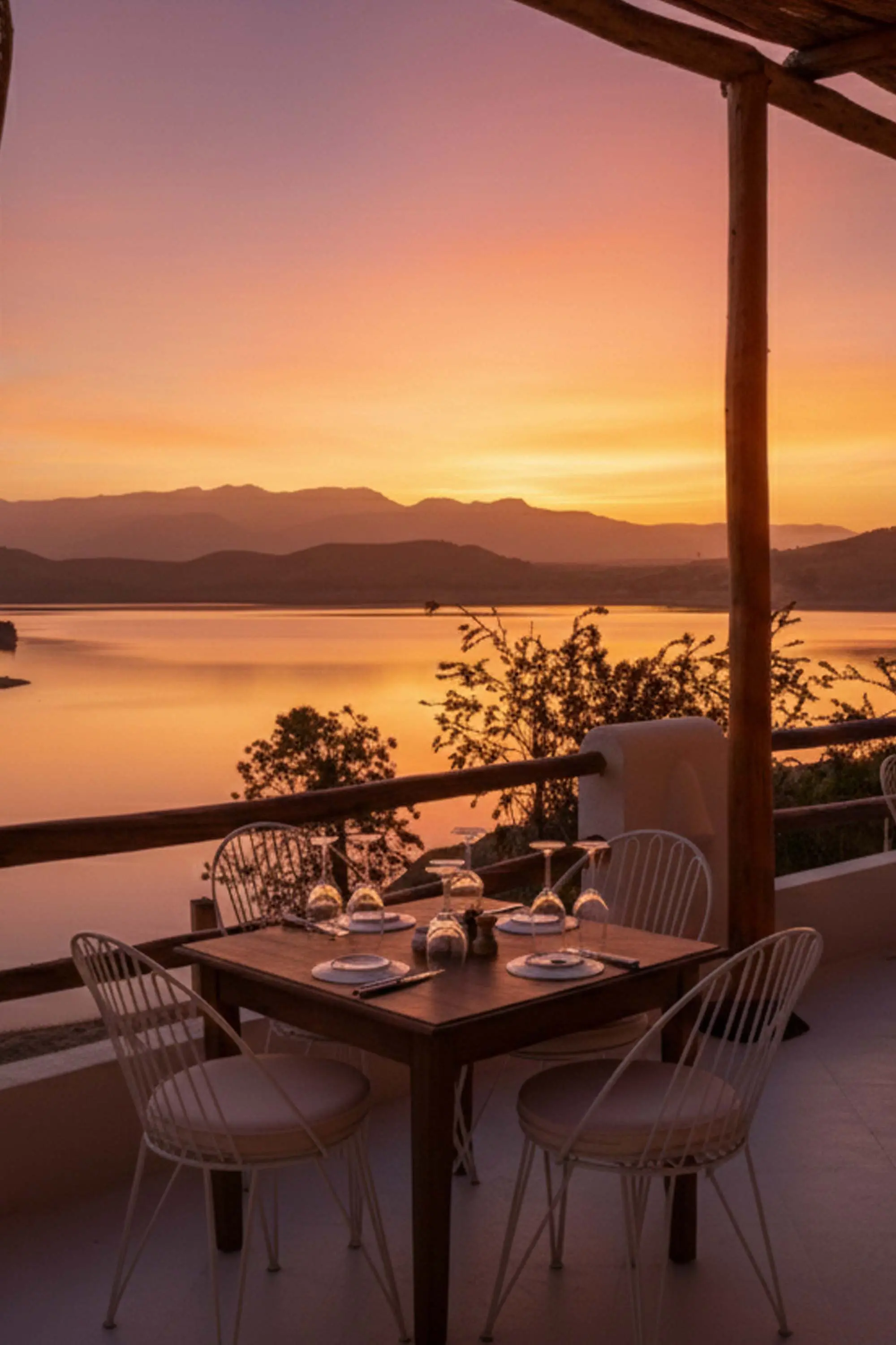 Elegant romantic dinner setup under the stars in the Agafay Desert with luxury service